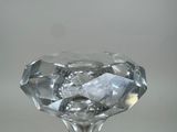a glass vase with a diamond shaped base on a table