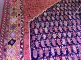 an image of a rug is being cleaned with a brush