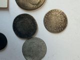 a lot of coins that are on the table