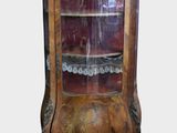 a wooden cabinet with a glass door on it