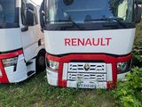 two red and white trucks parked next to each other