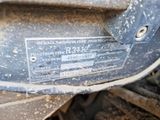 a close up of a metal plate on the front of a vehicle