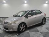 a picture of a silver toyota prius parked on a checkered floor