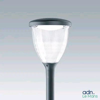 a close up of a street light on a pole with a white background