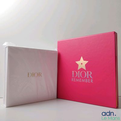 two boxes with a star on top of them sitting next to each other