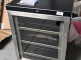 a small refrigerator that is sitting on the floor
