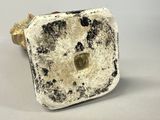a close up of a white and black object on a table