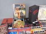 a lot of comic books sitting on a table