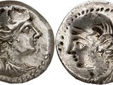 a silver coin with an image of a woman and a man on it