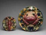 a crab and a crabfish on a decorative plate