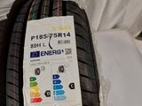 a close up of a tire on a bed with a sticker on it