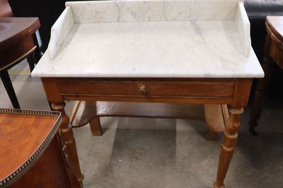 a marble top table with a drawer underneath it