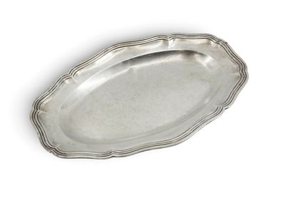 an oval silver tray with a scalloped edge on a white background