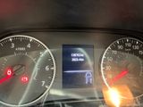 a close up of a car dashboard with various gauges