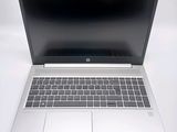 an open laptop computer sitting on top of a white table
