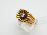 gold plated ring with a flower design and a diamond center