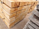 many pieces of wood stacked on top of each other
