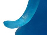 a close up of a blue object on a white surface