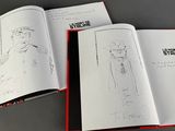a book with a drawing of a man in a hat