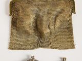 an image of a purse, earrings and a necklace on a white surface