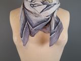 a close up of a mannequin torso with a scarf on it