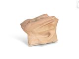 a small piece of clay sitting on a white surface