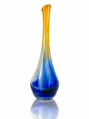 a blue and yellow vase sitting on a white surface