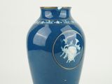 a blue vase with a picture of a horse on it