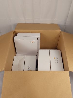 a cardboard box with a bunch of electronic devices inside of it