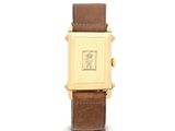 une photo d'une montre-bracelet plaquée or avec un bracelet en cuir marron