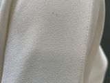 a close up of a white shirt on a mannequin mannequin