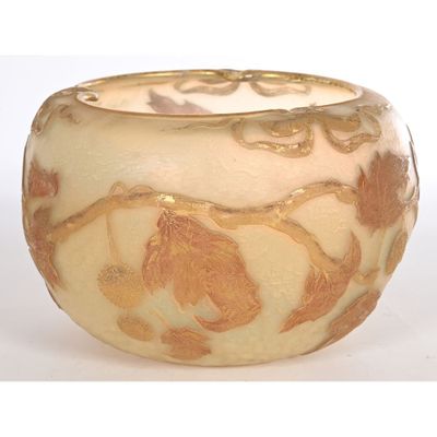 a white bowl with a gold design on it