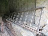 a pile of old metal bars in the corner of a room