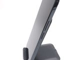 a close up of a cell phone on a stand