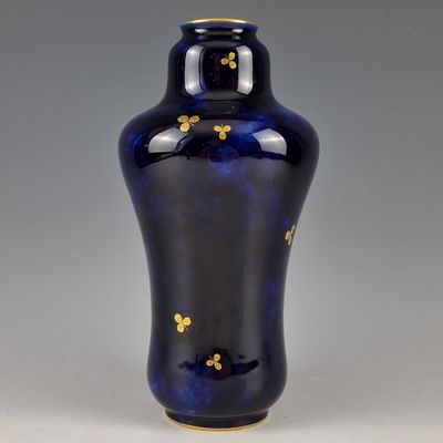 an image of a blue vase with gold decoration