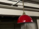 a red light hanging from the ceiling in a room