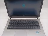 a laptop with a blue screen sitting on a table