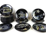 a lot of plates that have different designs on them