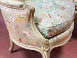 two chairs that are sitting on a pink carpeted floor
