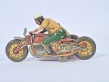 a figurine of a man riding a motorcycle