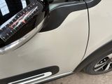 a close up of a car with a measuring tape on the side of it