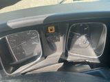 a close up of the dashboard of a car with the gauges on