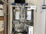 a bunch of wires on a shelf in a room