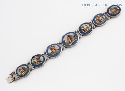 a close up of a bracelet with a picture on it