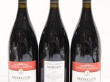 three bottles of wine sitting next to each other on a table