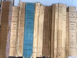 many books that are stacked on top of each other