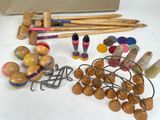 a lot of wooden toys and crochets on the table