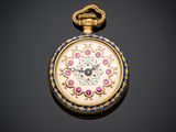 a close up of a pocket watch on a black surface