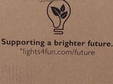 a cardboard box with a light bulb inside of it