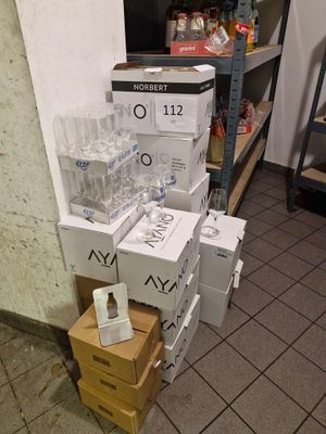 several boxes of water are stacked on top of each other in a room